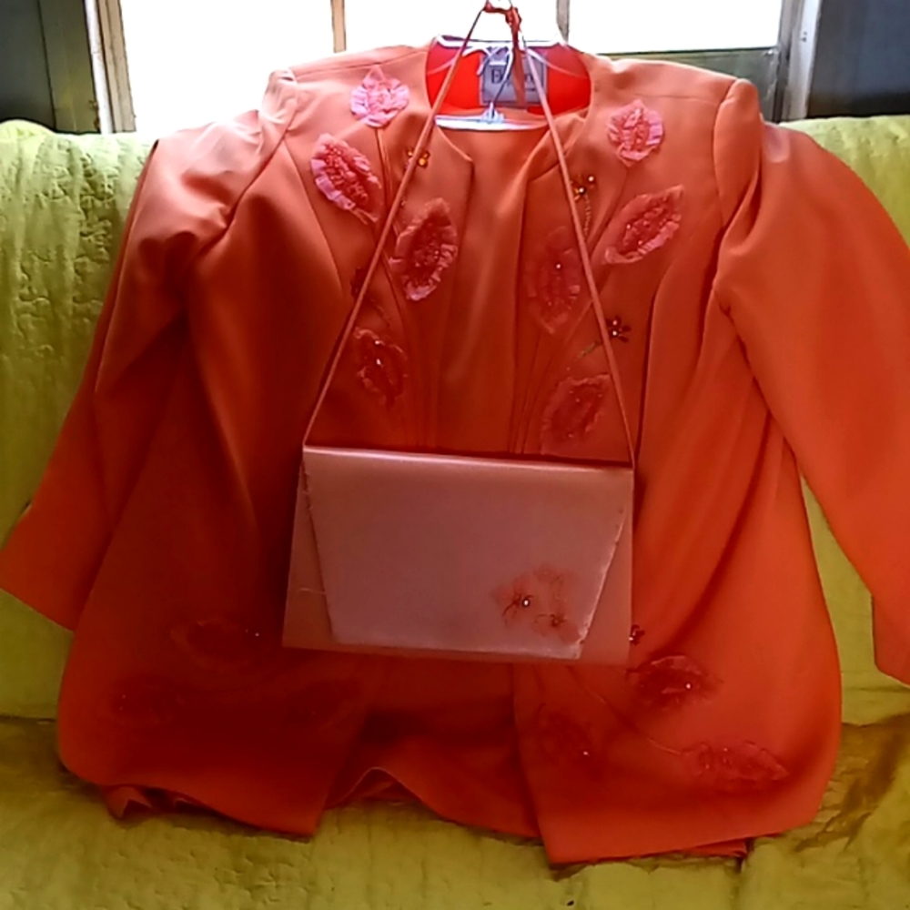 Peach elegance couture out fit with a Milano pocket book